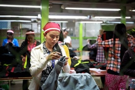 Garment workers in a factory in Cambodia on December 9, 2014. (ILO)