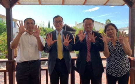 CNRP leaders Sam Rainsy and Ho Vann (third and second from the right) raise nine fingers along with other CNRP supporters in the U.S. on September 23, 2019 (CNRP activist’s Facebook page)