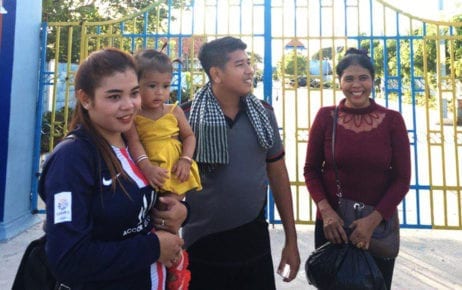 Activist Kung Raiya upon his release on bail from Prey Sar prison in Phnom Penh on November 29, 2019, with his wife holding their daughter (Supplied)