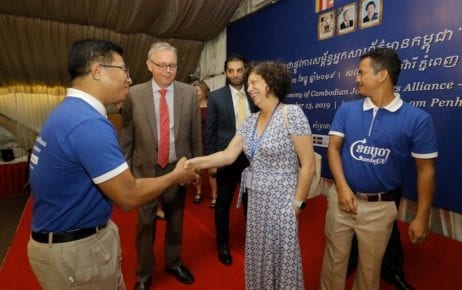 Swedish Ambassador Bjorn Haggmark (second left) looks on as Nop Vy, CamboJA’s director (left), shakes hands with EU Ambassador Carmen Moreno at the CamboJA launch event on December 13, 2019 in Phnom Penh. (CamboJA)