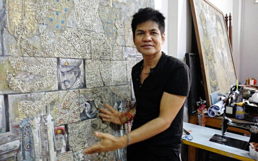 Leang Seckon in his studio in Phnom Penh explains one of his works. (Michelle Vachon)