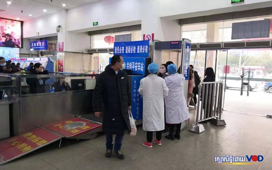 Chinese health officials check people for symptoms of novel coronavirus in Wuhan, China, on January 25, 2020. (Supplied by Cambodian students in Wuhan)