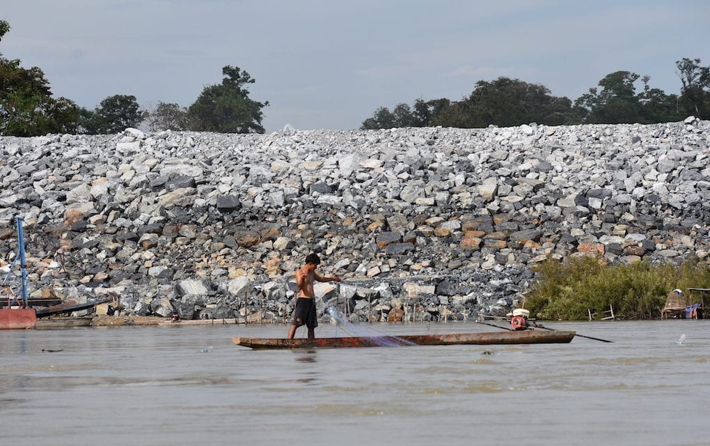 A fisherman in front of the Don Sahong cofferdam in Laos in 2016 (International Rivers)