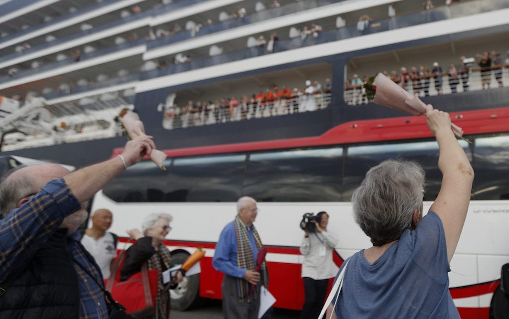 Passengers of the Holland America Line's Westerdam cruise ship wave in Sihanoukville on February 14, 2020. (Panha Chorpoan/VOD)