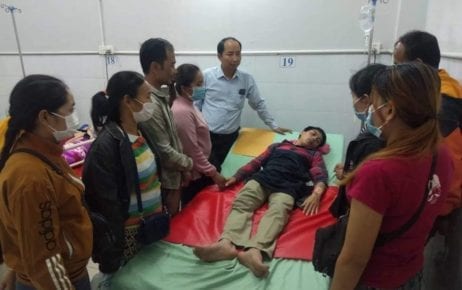 Union leader Ath Thorn visits unionist Soeung Pros in a hospital, in this photograph posted to the Cambodian Labor Confederation’s Facebook page on February 11, 2020. Pros was attacked by five unidentified men outside the Phnom Penh factory where he works on February 10.