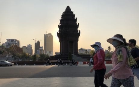 People walk near Independence Monument in Phnom Penh on March 26, 2020. (Matt Surrusco/VOD)