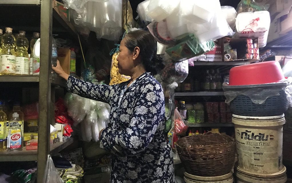 Chan Pha, 57, sells spices and sauces in Takeo market in late March 2020. (Ouch Sony/VOD)