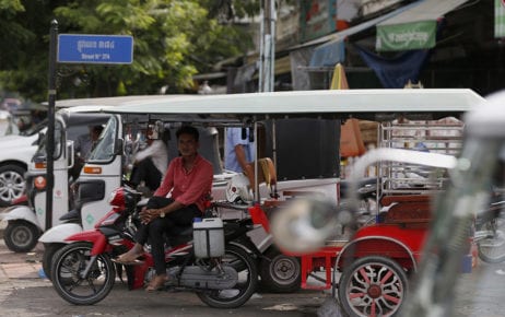 A driver sits in his tuk-tuk, awaiting clients at Deumkor market in Phnom Penh on April 23, 2020. (Panha Chorpoan/VOD)