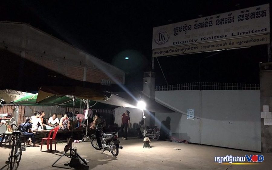 Former Dignity Knitter workers rest under a tent in front of the closed garment factory in Takhmao City on May 1, 2020. (Hun Sirivadh/VOD)