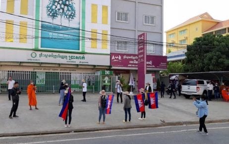 Members of Cambodian youth group Khmer Thavrak protest outside the offices of Prasac and AMK, two of the country’s largest microfinance lenders, in Battambang province on May 9, 2020 (Licadho)
