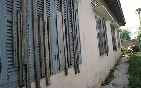 The rear windows of a formerly used building at the Prey Speu detention center in Phnom Penh, which were boarded shut so detainees could not escape through them. (Licadho)