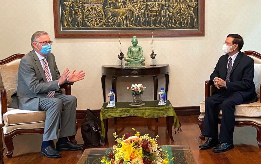 Sweden's Ambassador to Cambodia Bjorn Haggmark (left) meets with Kem Sokha, leader of the dissolved main opposition CNRP, at Sokha's home, in this photograph posted to Sokha's Facebook page on May 19, 2020.
