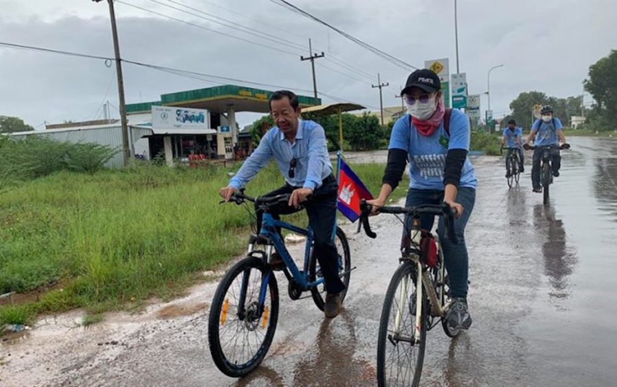 Union leader Rong Chhun, left, cycles with youth activists who planned to ride from Koh Kong province to Phnom Penh in June 2020, aiming to petition the government to make Koh Kong Krao a protected area. (Supplied)