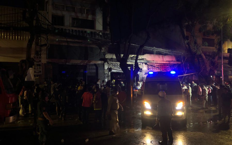 An ambulance and first responders surround the site of an explosion in central Phnom Penh after flames were extinguished on the evening of July 18, 2020 (Matt Surrusco/VOD)