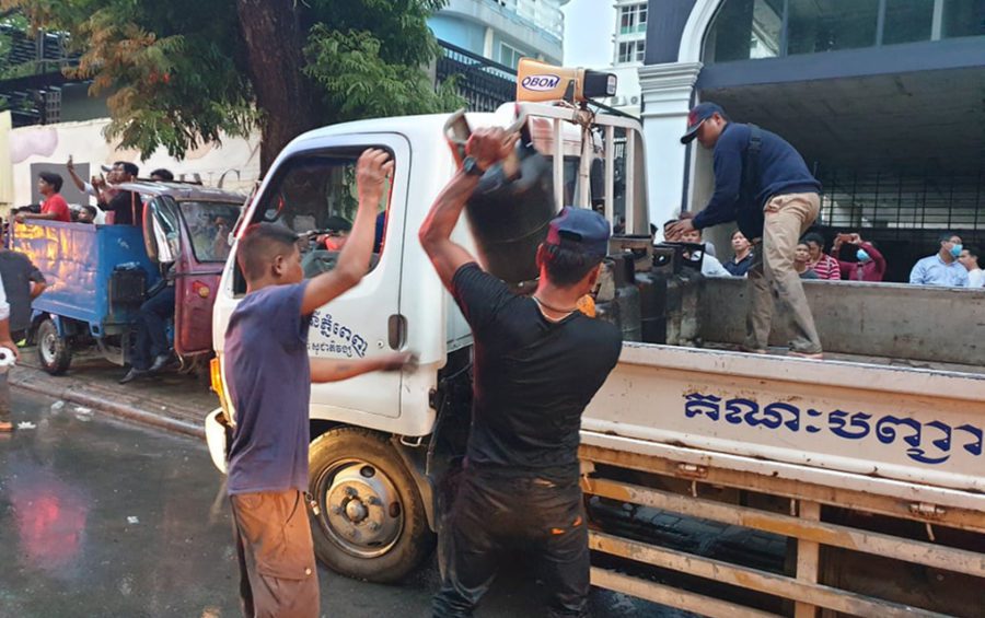 Authorities remove gas canisters at the site of an explosion in Phnom Penh on July 18, 2020. (Mech Dara/VOD)