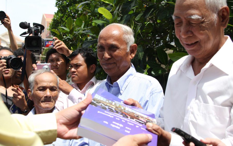 Bou Meng (left), Chum Mey (center) and Vann Nath (right) after receiving a copy of the verdict against Kaing Guek Eav, known as "Duch," on August 12, 2010. They are three of only a handful of survivors of the Khmer Rouge prison S-21, where more than 10,000 people were tortured and executed. (ECCC)