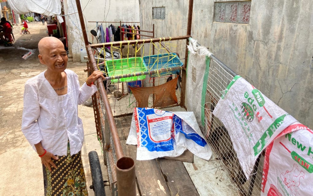 Keo Pao, an edjai in Poipet, shows the cart she uses to collect recyclable waste in the border city. (Ananth Baliga/VOD)