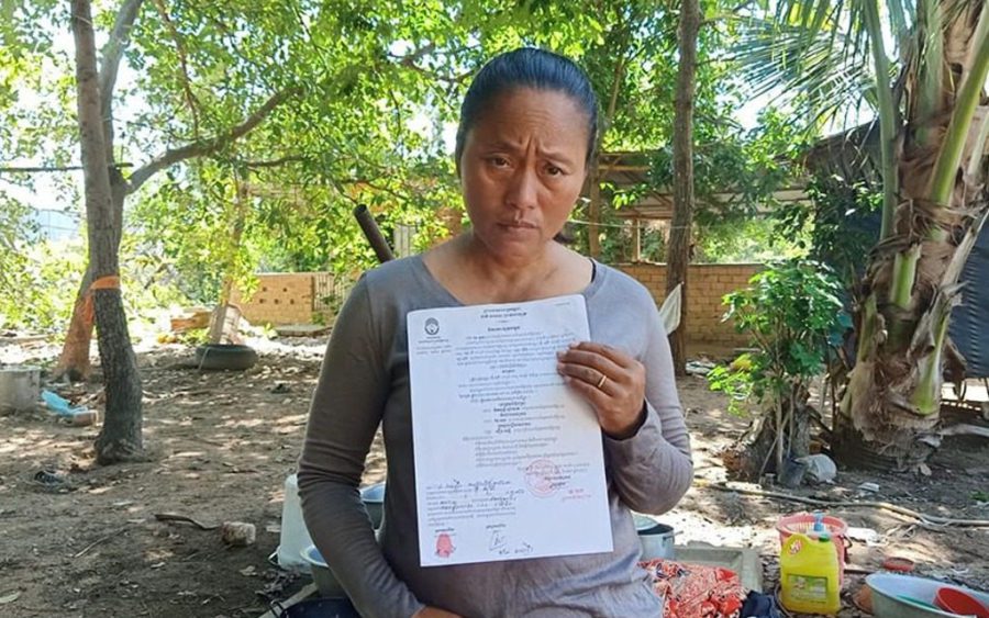 Oum Sophy, a representative of land protesters in Kampong Chhnang province’s Lor Peang village, holds up a court order, in a photo posted to the Lor Peang community’s Facebook page.