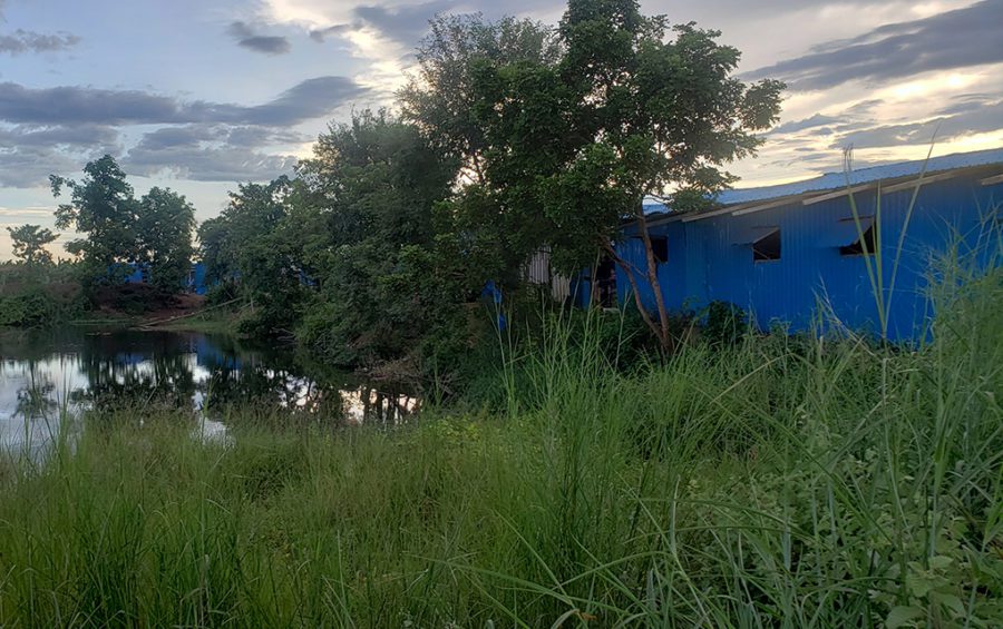 The company-provided housing and reservoir, which workers use for bathing and cleaning, at TBYB Angkor Banana, an export-grade banana plantation in Stung Treng province's O'Svay commune on September 23, 2020. (Danielle Keeton-Olsen/VOD)