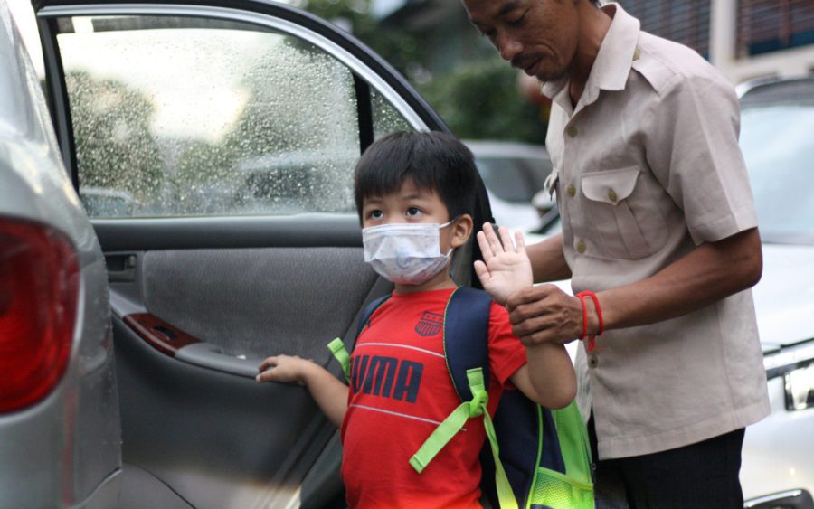 A student from Bamboo International School in Phnom Penh heads home after his first day at school since Covid-19 closures in March, on October 1, 2020. (Michael Dickison/VOD)