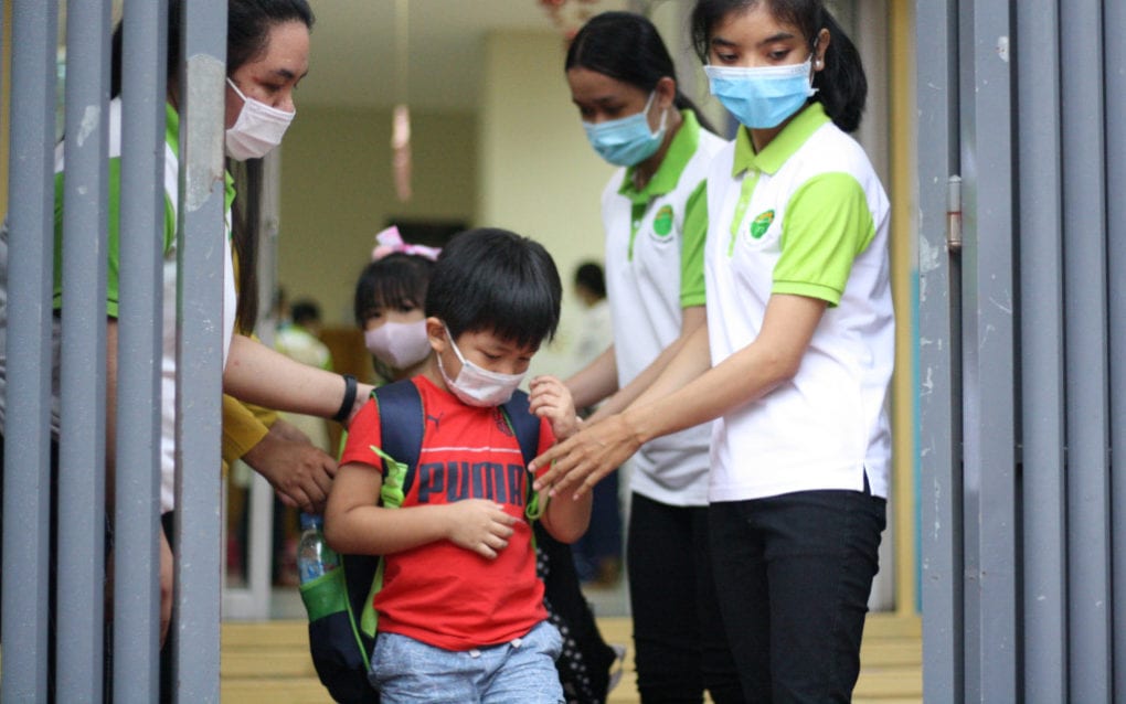 A student from Bamboo International School in Phnom Penh heads home after his first day at school since Covid-19 closures in March, on October 1, 2020. (Michael Dickison/VOD)