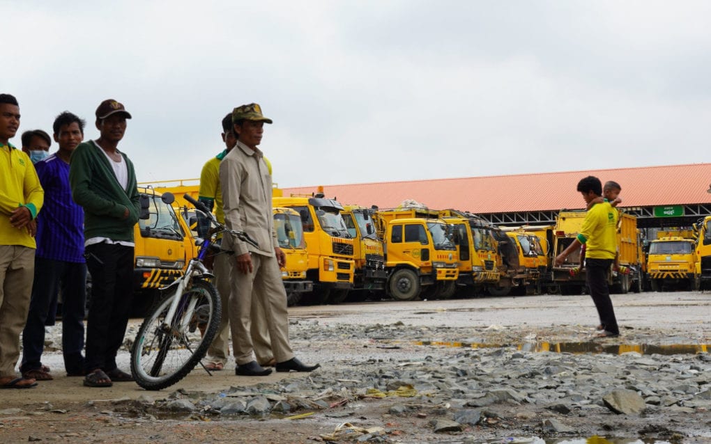 Striking Cintri workers stand in the company’s parking lot for garbage trucks in Phnom Penh’s Daun Penh district on October 7, 2020. (Tran Techseng/VOD)