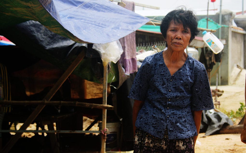 Tim Sarong, 66, is staying under a makeshift tarpaulin roof after flooding destroyed her home in Phnom Penh’s Dangkao district, on October 12, 2020. (Michael Dickison/VOD)