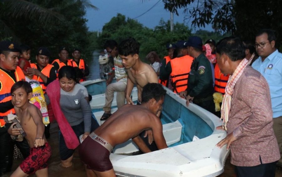 People are evacuated by boat due to flooding in Kampong Speu province's Chbar Mon City on October 14, 2020, in this photo supplied by Kampong Speu governor Vei Samnang.