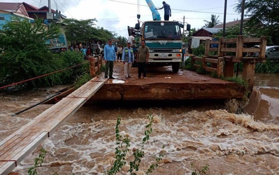 Officials from Battambang Provincial Department of Public Works and Transport inspect a damaged bridge after severe flooding from October 10 to 11, 2020, in this photograph posted to the department's Facebook page.