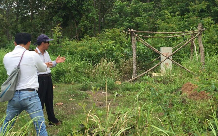 Jailed unionist Rong Chhun, wearing sunglasses, observes a marker along Cambodia’s border with Vietnam in Tbong Khmum province’s Trapaing Phlong commune, in a photograph posted to his Facebook page on July 21, 2020.