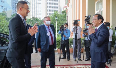 Cambodian Foreign Affairs Minister Prak Sokhonn greets his Hungarian counterpart, Peter Szijjarto, in front of several camera operators during Szijjarto's visit in Phnom Penh on November 3, 2020.