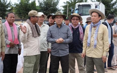 Agriculture Minister Veng Sakhon, with hands folded, visits farmers affected by flooding in Pursat province on November 4, 2020, in this photograph posted to his Facebook page.