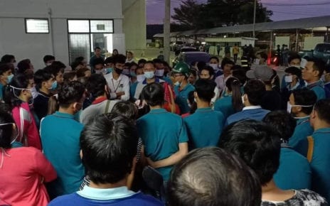 Workers gather outside the GFN chicken factory in Thailand’s Chon Buri province on November 11, 2020, in a photo posted to the Facebook page of labor rights group Central.