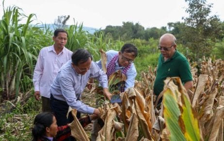 CNRP co-founder Kem Sokha, left, and GDP co-founder Yang Saing Koma, center, pick crops during a visit to a farm in Pursat province in November 2020, in this photograph posted to Saing Koma's Twitter page.
