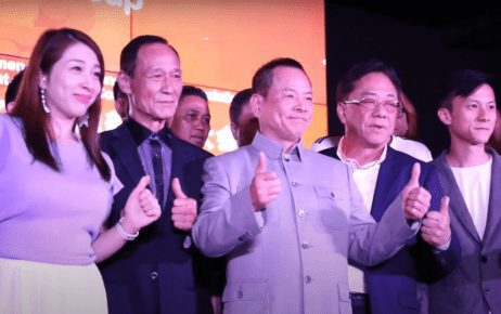 Former Macau crime boss Wan Kuok Koi, also known as “Broken Tooth,” (center) at a ceremony in Kuala Lumpur in July 2018 marking the establishment of the World Hongmen History and Culture Association headquarters, in a screenshot from a promotional video.
