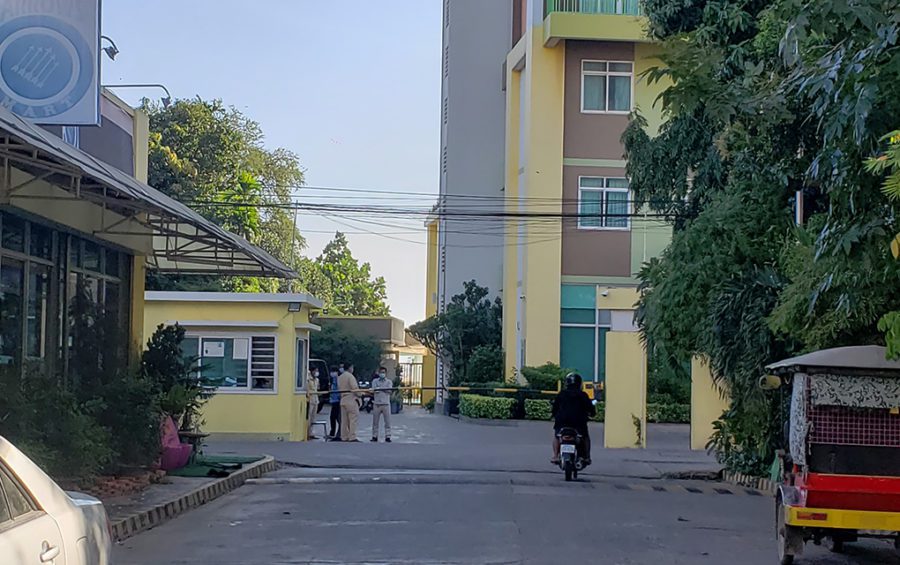 Guards gather at the gate of the Mekong Gardens condominium in Phnom Penh's Chroy Changva district during a ceremony marking Wanchalearm Satsaksit's disappearance, on December 4, 2020. (Danielle Keeton-Olsen/VOD)