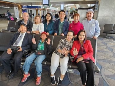 CNRP supporter Jeng Sheng Quach, top left, with other CNRP supporters at the Los Angeles International Airport before leaving for Thailand in November 2019. (Supplied)