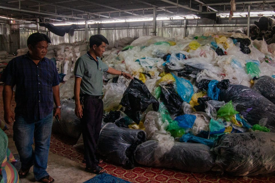 Nirat Khaengkhan and Neang Chanthara of Battambang Plastics Products explain how they collect, dry, organize and eventually recycle plastic bags from across Cambodia, on November 6, 2020. (Gerald Flynn/VOD)