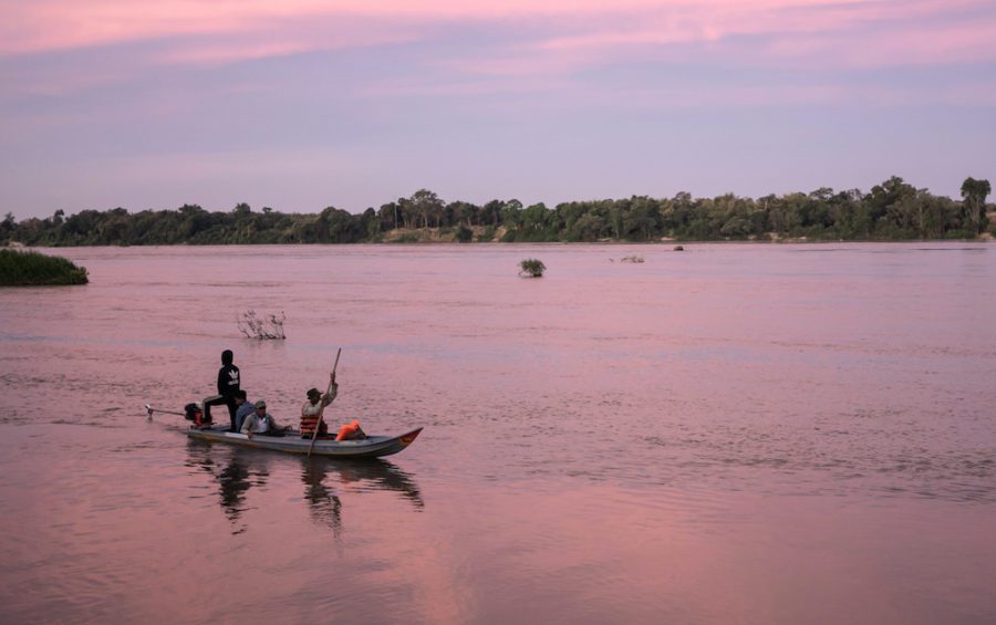 Community fishery patrollers drive back to Kampong Kbeung village in a modified boat confiscated from illegal fishers that is now used by the patrol team. An increasing number of illegal fishers are modifying the hulls of their boats so that they can outpace the community patrol boats. (Andy Ball)