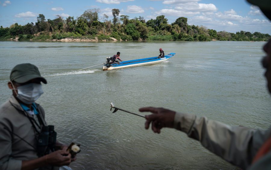 The patrol team removes fishing nets that had been illegally set in a protected deep pool. (Andy Ball)