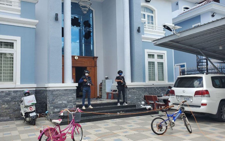 Authorities guard a villa in Borey Angkor Phnom Penh where an alleged kidnapping attempt and fatal shootout occurred, in a photo posted to the Phnom Penh Military Police Facebook page on March 1, 2021.