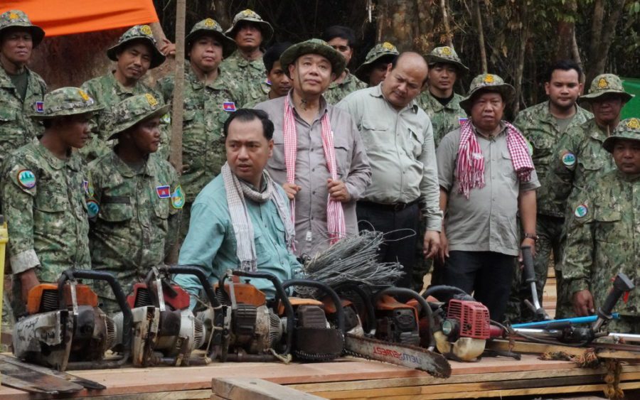 Environment Ministry spokesperson Neth Pheaktra shows confiscated chainsaws at the Prey Lang Wildlife Sanctuary during a government-organized trip, on February 14, 2021. (Tran Techseng/VOD)