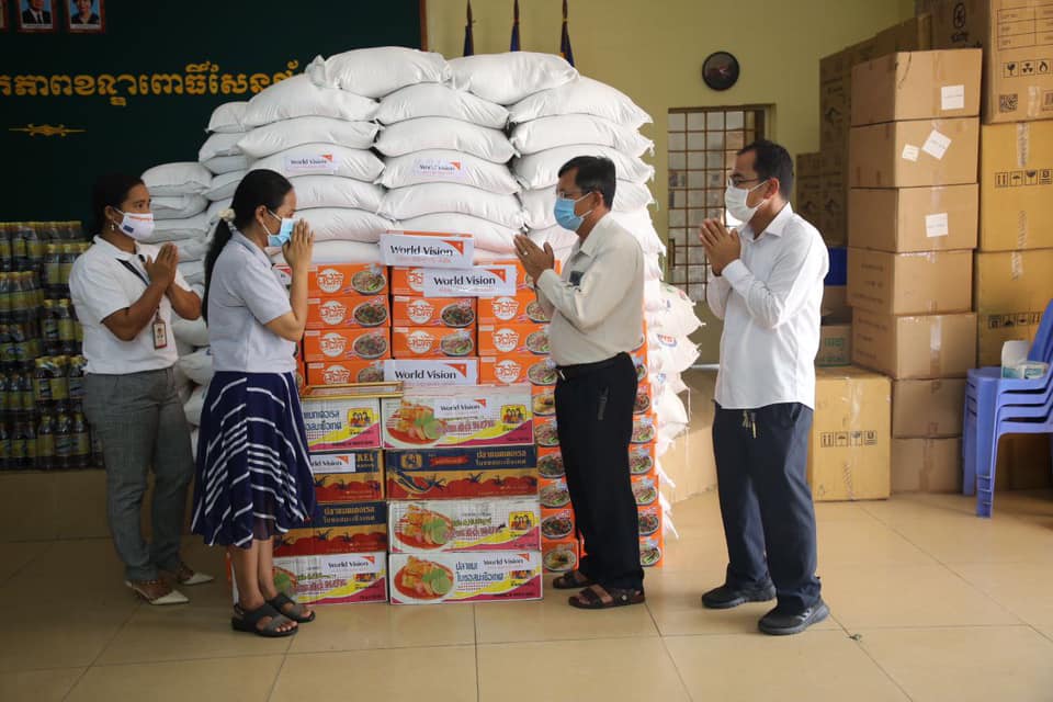 Representatives from the NGO World Vision donate Mee Chiet instant noodles and other food to the Pur Senchey district office for distribution in a photo posted to the district's Facebook page on May 14, 2021.