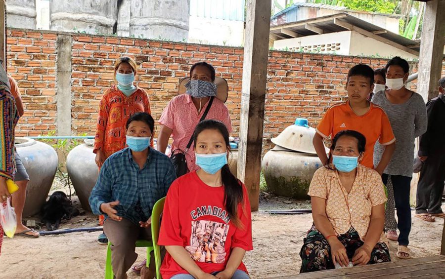 Banteay Dek commune residents, including Sok Kakada, 24 (center), and Cheang Sinoun (left) gather and speak about a protest and arrest over disputed land in Kandal province's Kien Svay district on June 2, 2021. (Danielle Keeton-Olsen/VOD)