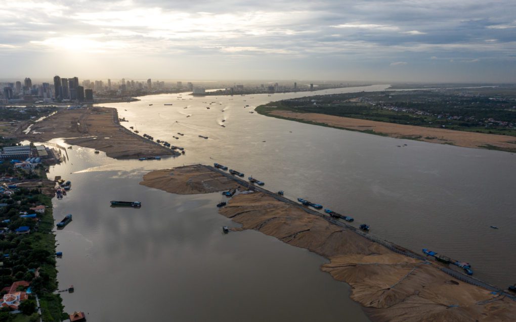 Phnom Penh’s Koh Norea development and, on the far bank, Khun Sea’s satellite city landfill project in Kandal’s Akrei Khsat. (Andy Ball/VOD)