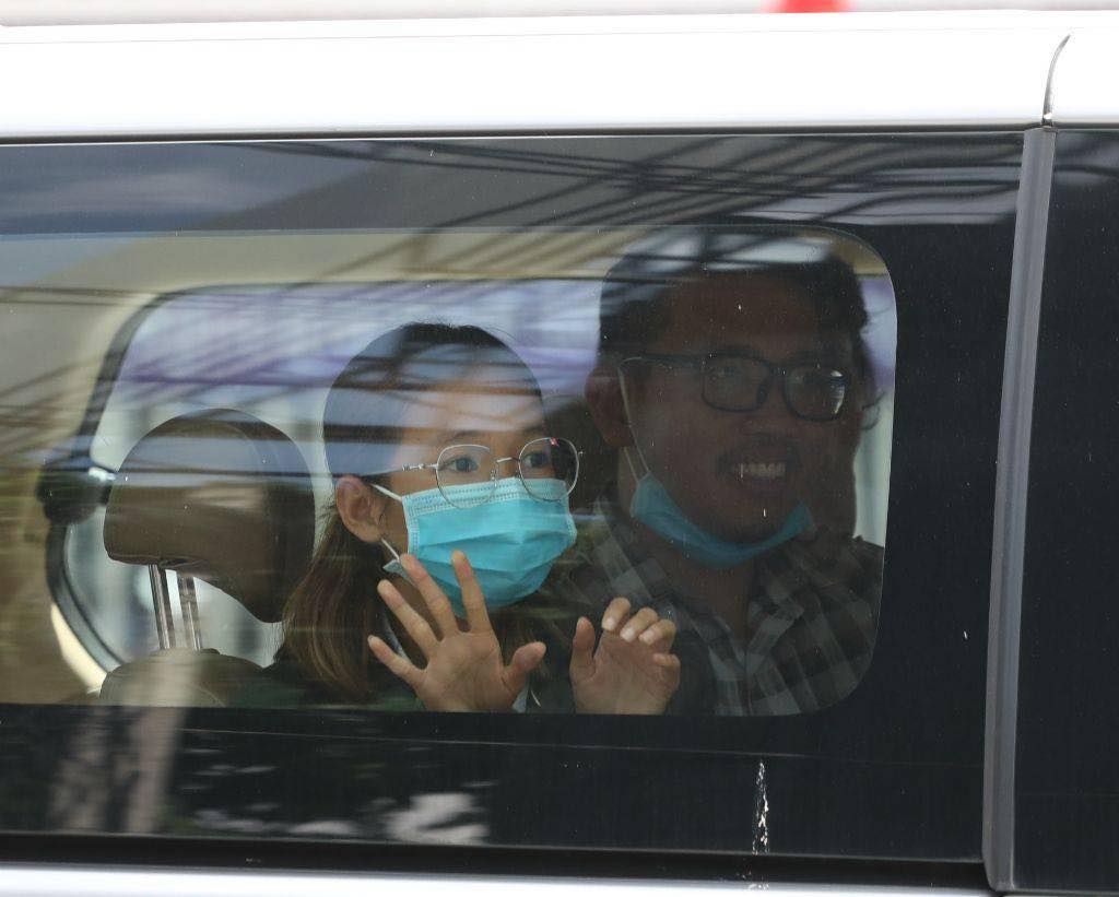 Sun Ratha, left, and Yim Leanghy sit inside a car in a photo posted to Mother Nature Cambodia's Facebook page on June 20, 2021.