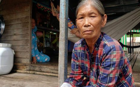 Nhung, 61, born in Cambodia, escaped targeted killings against ethnic Vietnamese residents during the Khmer Rouge era. She speaks to reporters after being evicted from her home on the river by Phnom Penh authorities. (Danielle Keeton-Olsen)