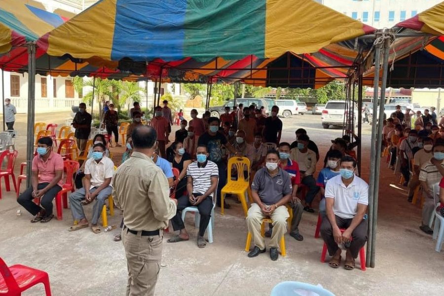 Provincial officials and frontline workers wait in a tent for 3rd vaccine doses ahead of the border reopening, in a photo posted to the Banteay Meanchey Administration's Facebook page on August 9, 2021.