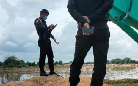 Armed guards stood by as authorities dug a ditch into land disputants’ land in Kandal province’s Kandal Stung district on September 1, 2021. (Supplied)