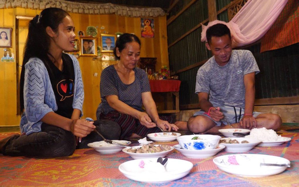 Kea Channa, Boun Nai and Kea Sokun eat dinner together at their home in Siem Reap for the first time in a year after Sokun’s release from prison on September 3, 2021. (Jack Brook/VOD)